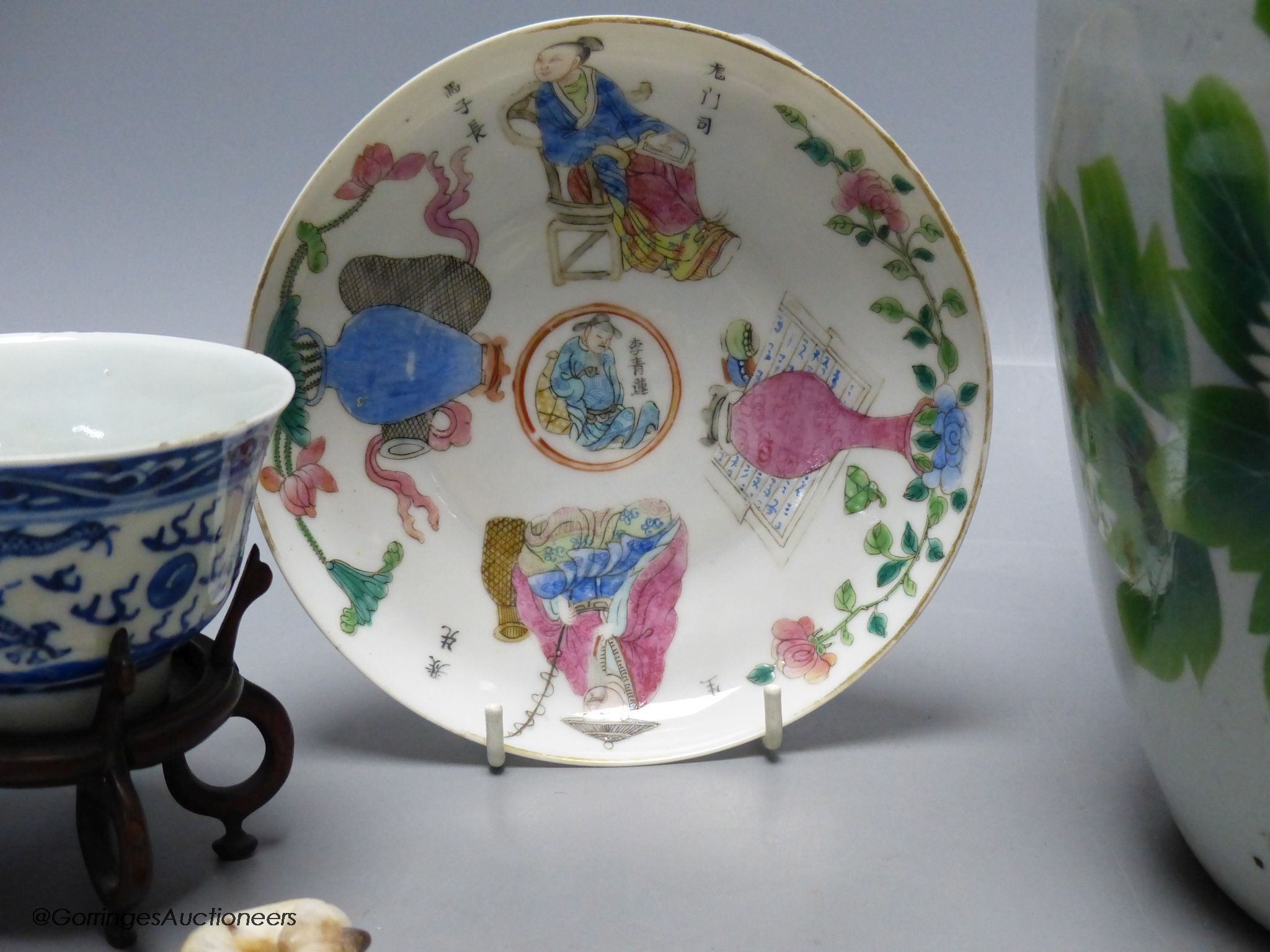 A 19th century famille rose bowl and stand, a blue and white cup, a famille rose jar and a stone carving of two monkeys